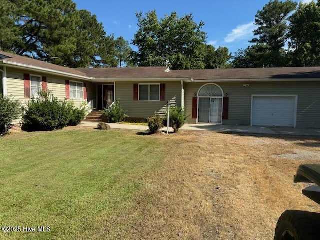 single story home featuring an attached garage and a front lawn