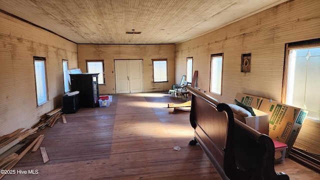 interior space with hardwood / wood-style floors and wooden ceiling