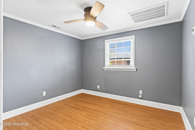 spare room with ornamental molding, hardwood / wood-style floors, and ceiling fan