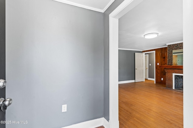 interior space with ornamental molding and hardwood / wood-style floors