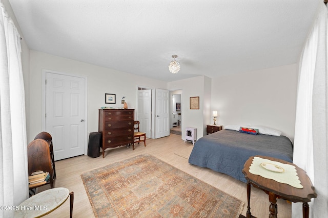 bedroom with light hardwood / wood-style flooring