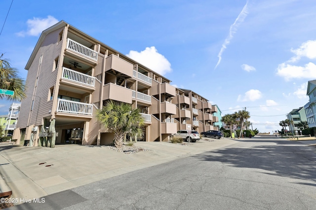 view of building exterior with a carport