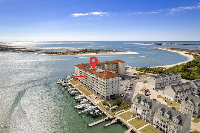 birds eye view of property with a water view