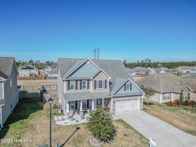 view of front of property featuring a garage, a porch, cooling unit, and a front lawn