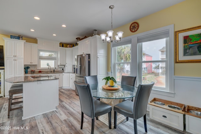 2017 W Beach Dr, Oak Island, NC 28465 - dining space featuring a chandelier, plenty of natural light, light wood-style floors, and recessed lighting