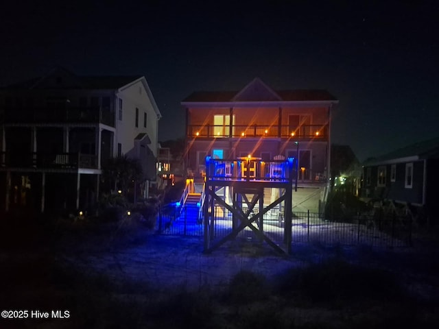 2017 W Beach Dr, Oak Island, NC 28465 - view of back of house at night