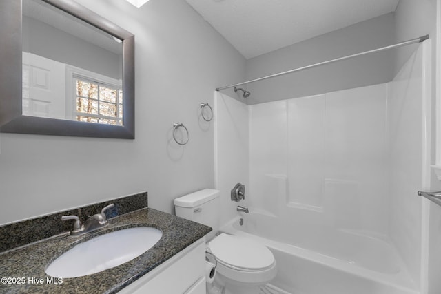 bathroom featuring toilet, a textured ceiling, shower / tub combination, and vanity