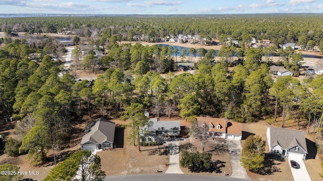 aerial view with a residential view and a view of trees