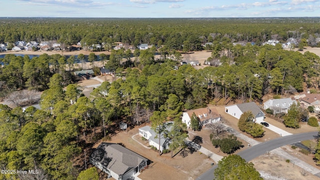 bird's eye view with a residential view and a wooded view