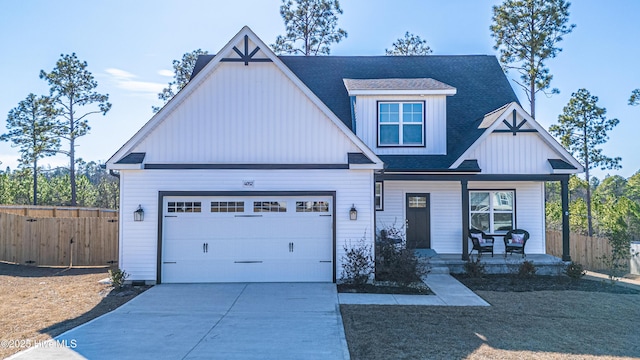 craftsman inspired home with a garage and covered porch