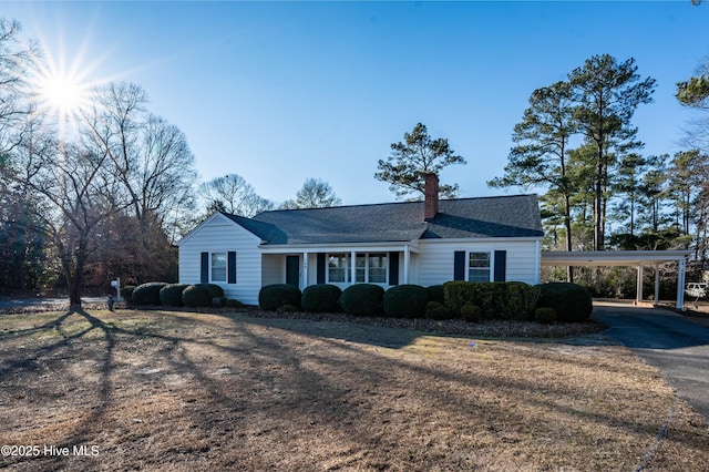 single story home with a carport