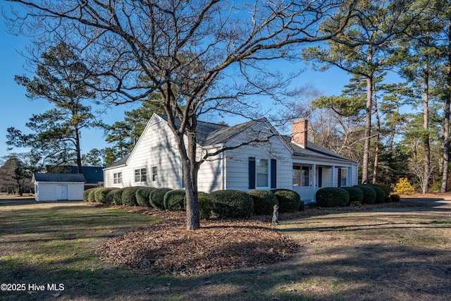 view of home's exterior featuring a yard and a storage shed