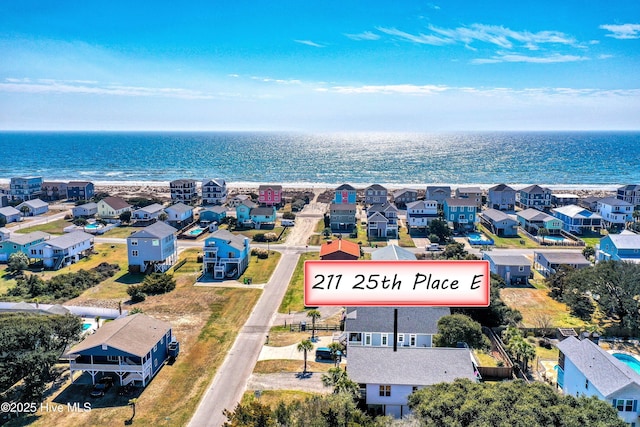 bird's eye view featuring a water view and a residential view