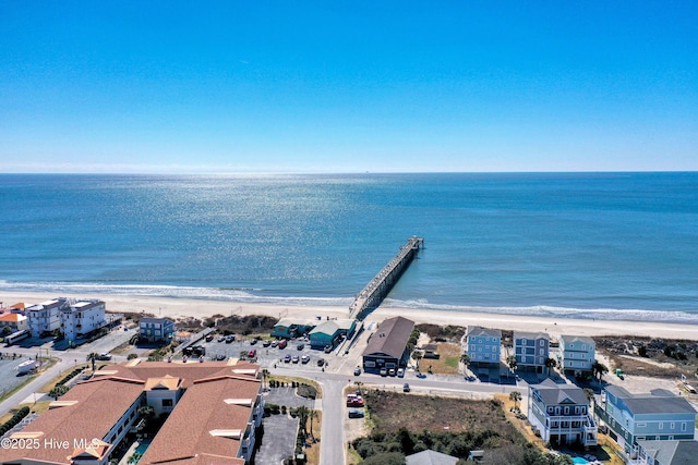 bird's eye view featuring a water view and a view of the beach