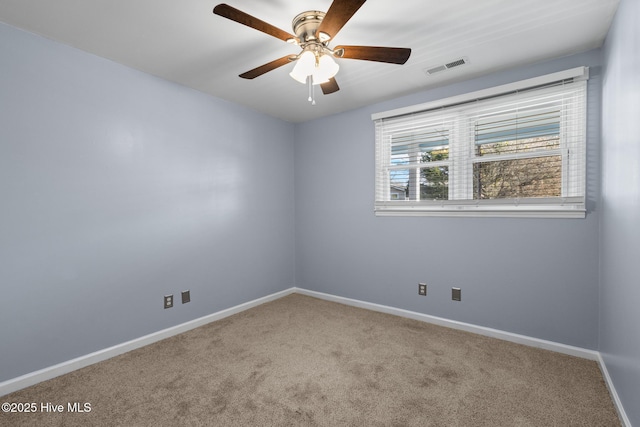 spare room with carpet flooring and ceiling fan