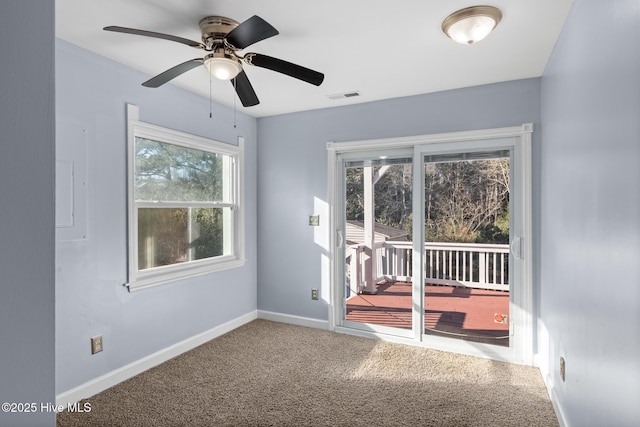 carpeted empty room featuring ceiling fan