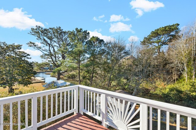 wooden deck featuring a water view