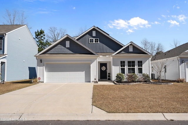 view of front facade with a garage and a front lawn