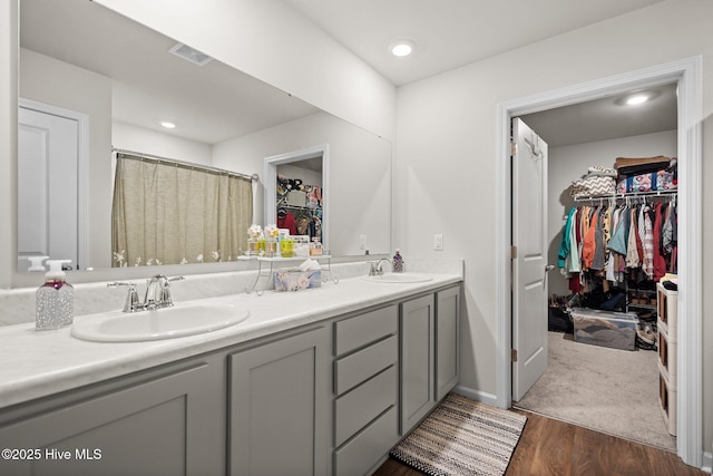 bathroom with vanity and wood-type flooring