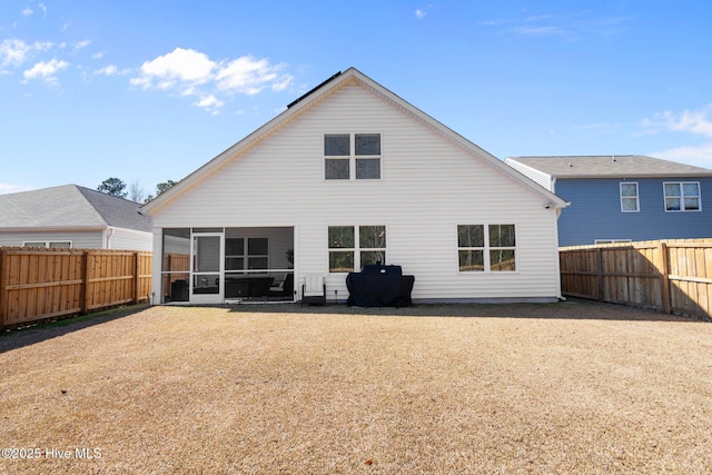 back of property featuring a sunroom