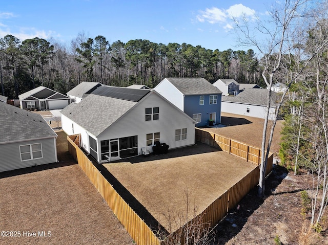 rear view of house with a sunroom