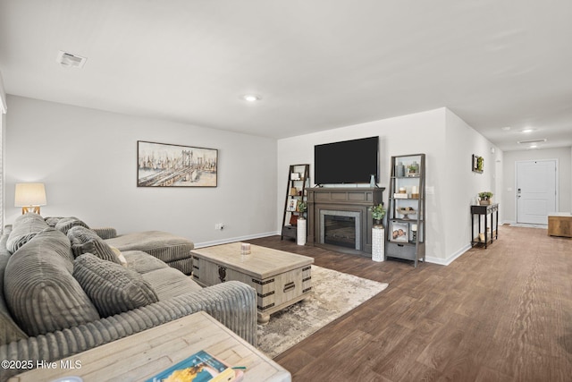 living room featuring dark wood-type flooring