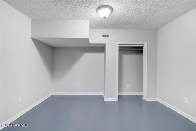 unfurnished bedroom with a textured ceiling