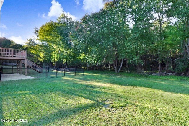 view of yard with a wooden deck