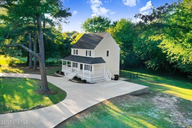 view of front of property with a porch and a front yard