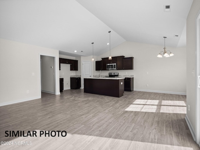 165 Vista Cay Dr, Hubert, NC 28539 - kitchen with hardwood / wood-style floors, pendant lighting, a chandelier, stainless steel appliances, and a center island with sink