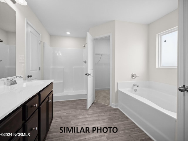 165 Vista Cay Dr, Hubert, NC 28539 - bathroom with vanity, plus walk in shower, and hardwood / wood-style floors