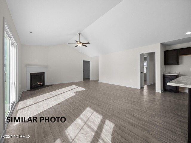 165 Vista Cay Dr, Hubert, NC 28539 - unfurnished living room featuring vaulted ceiling, ceiling fan, and hardwood / wood-style floors