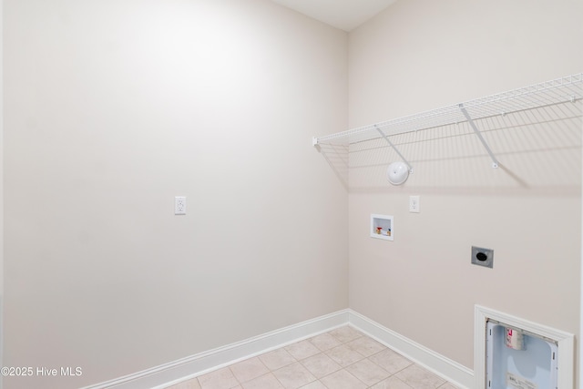 washroom featuring laundry area, baseboards, gas dryer hookup, washer hookup, and electric dryer hookup