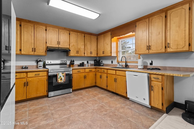 kitchen with under cabinet range hood, dishwasher, light countertops, electric stove, and a sink