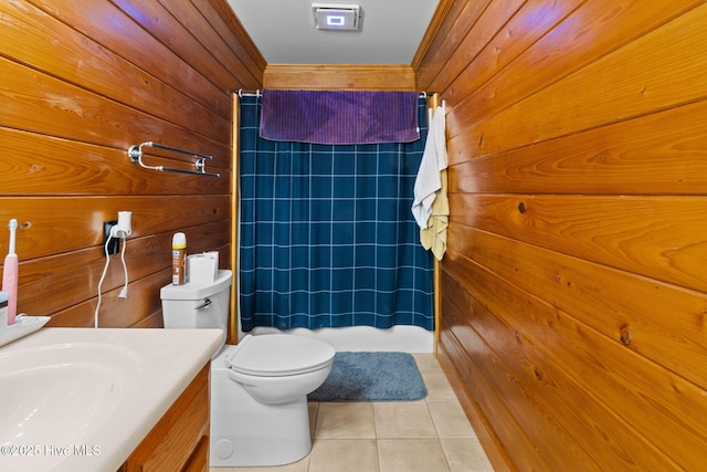 full bathroom with tile patterned floors, toilet, curtained shower, wood walls, and vanity