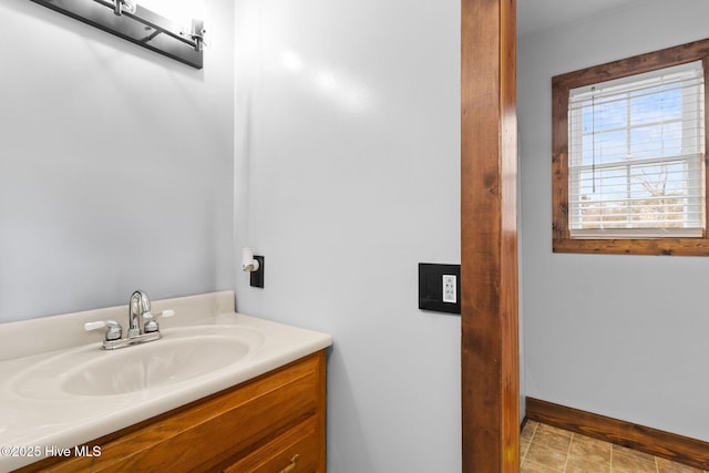 bathroom with baseboards and vanity