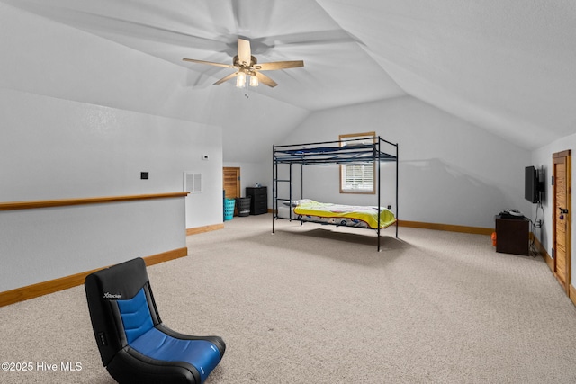 carpeted bedroom featuring vaulted ceiling, baseboards, visible vents, and ceiling fan