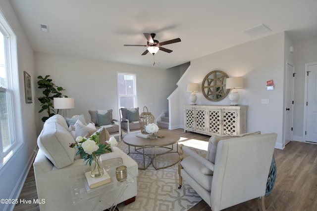 living room with hardwood / wood-style floors and ceiling fan