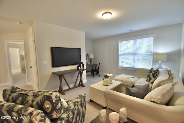 living room featuring light colored carpet