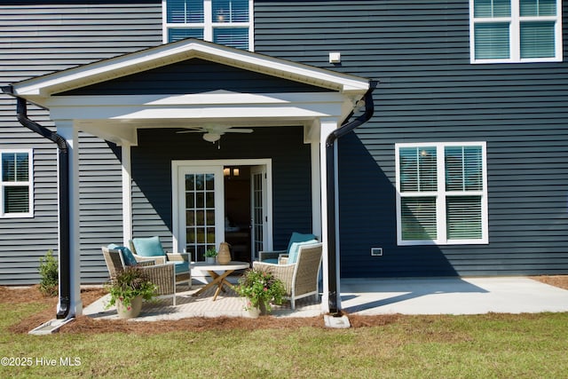 entrance to property with a lawn, a patio, and ceiling fan