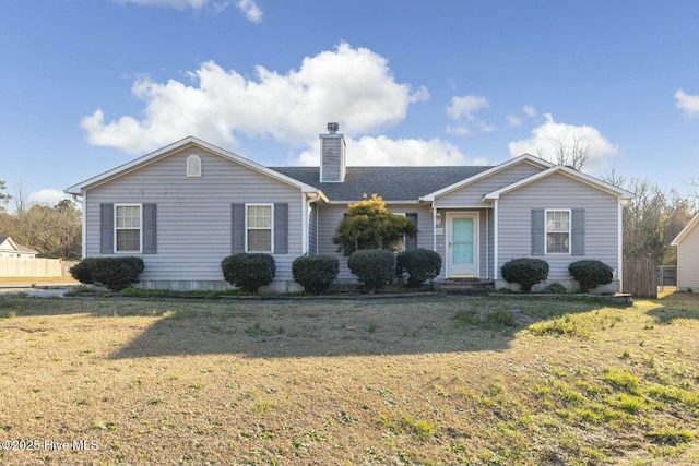 single story home with a shingled roof, a chimney, and a front yard