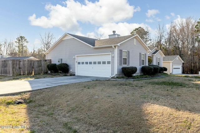 view of home's exterior featuring a shingled roof, a lawn, concrete driveway, an attached garage, and fence