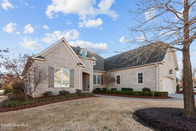 view of property with a front yard and a garage