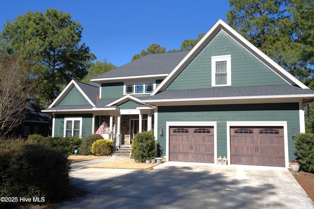 view of front facade featuring a garage, concrete driveway, and a shingled roof