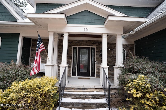 view of exterior entry with stone siding