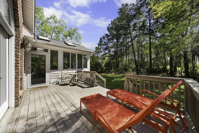 wooden terrace with a sunroom