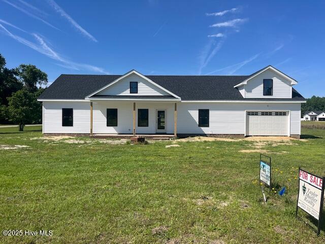 101 Mill Creek Rd, Edenton, NC 27932 - view of front of house featuring covered porch, a garage, and a front lawn