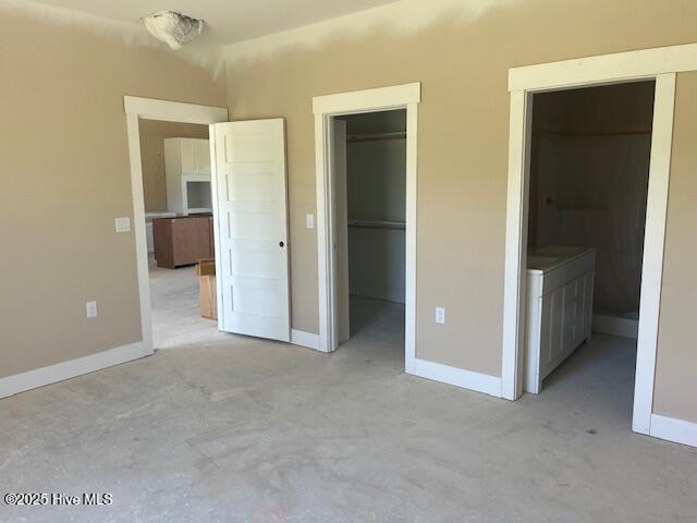101 Mill Creek Rd, Edenton, NC 27932 - unfurnished bedroom featuring a spacious closet, baseboards, a closet, and light colored carpet
