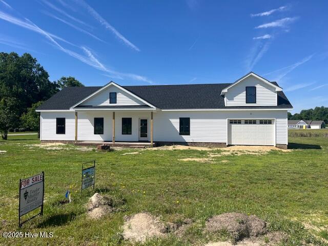 101 Mill Creek Rd, Edenton, NC 27932 - view of front of home with covered porch, a garage, and a front yard