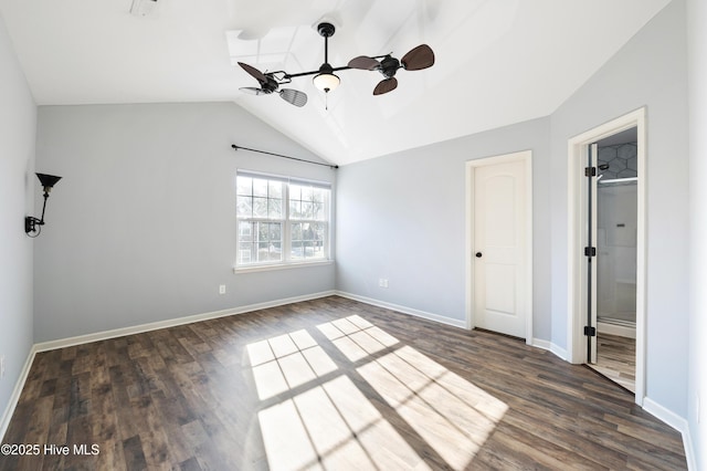 unfurnished bedroom with dark wood-type flooring, vaulted ceiling, and ceiling fan